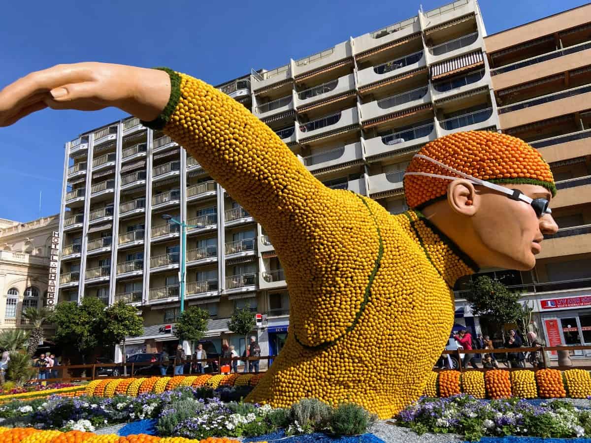 Lemon sculpture of a swimmer doing the butterfly made out of citrus fruit at the festival of lemons in Menton France