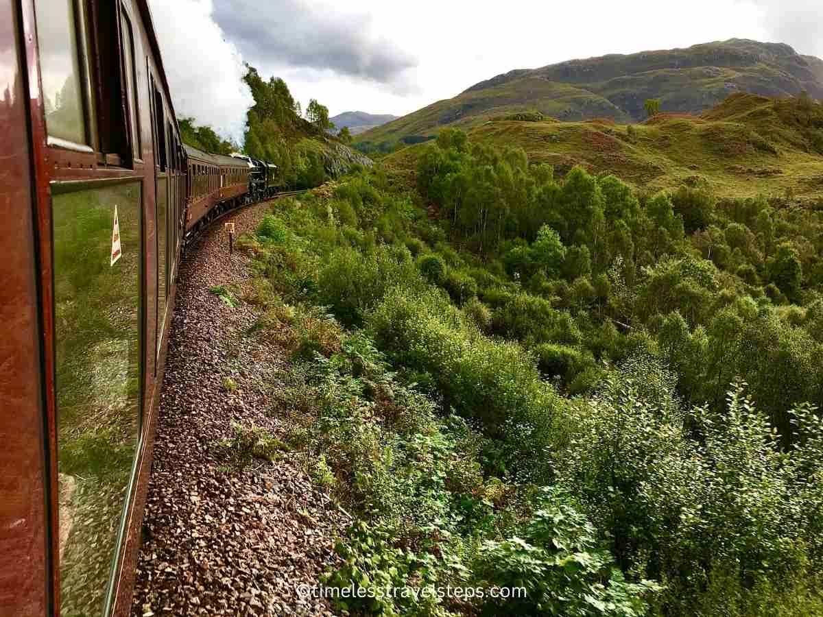 the Jacobite Steam Train as it approaches the Glenfinnan Viaduct 