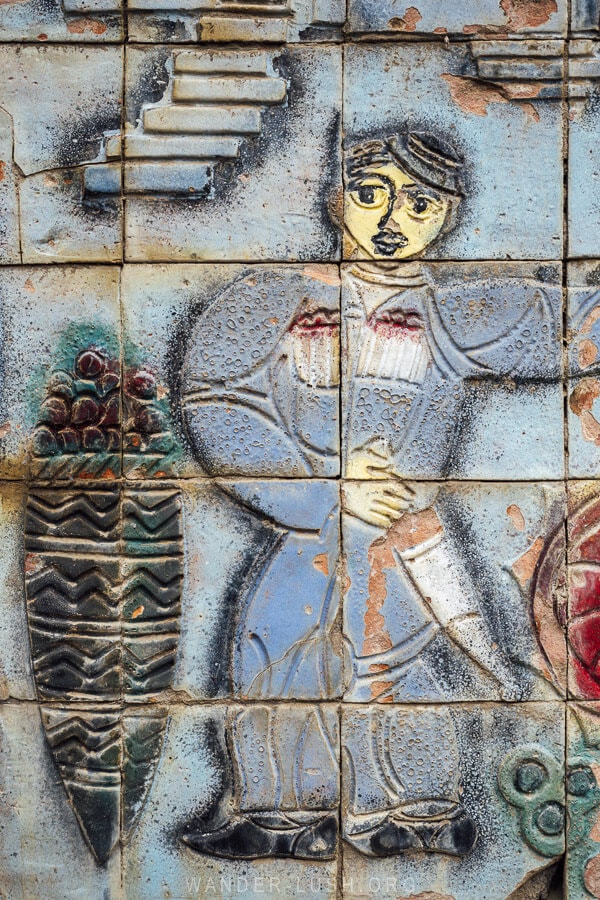 A Soviet-era mosaic in Georgia depicts a man from Guria region growing grapes.