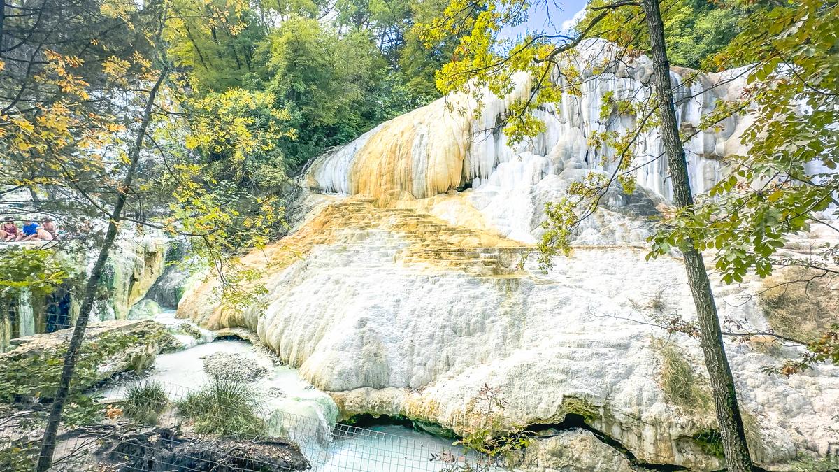 Visitors relaxing at Fosso Bianco Hot Springs, Italy