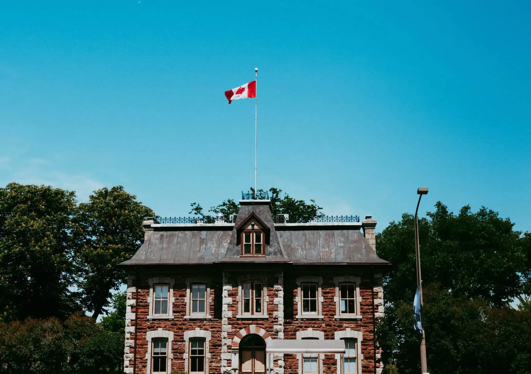 Historic home in Sault Ste Marie with the Canada flag