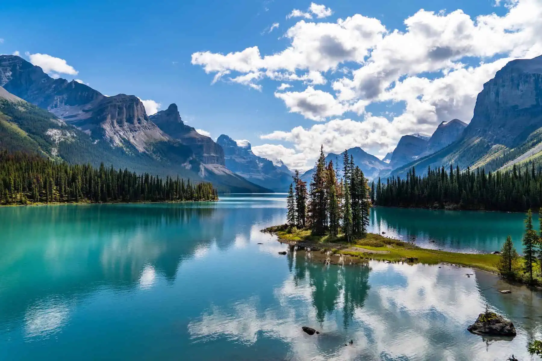 View of mountains, water and trees on Maligne Lake in Jasper, Alberta