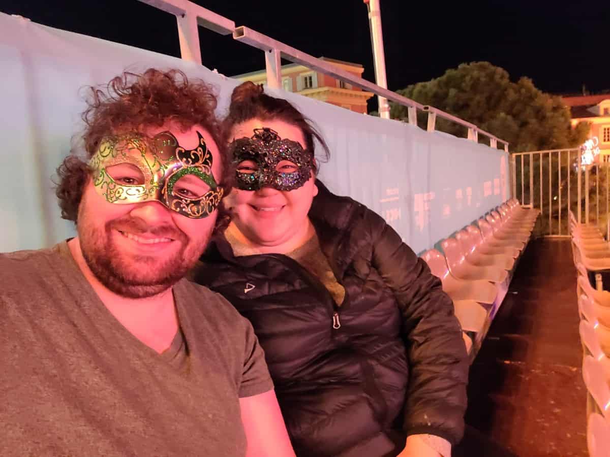 Colin and Riana wearing masquerade masks at the Nice Carnival