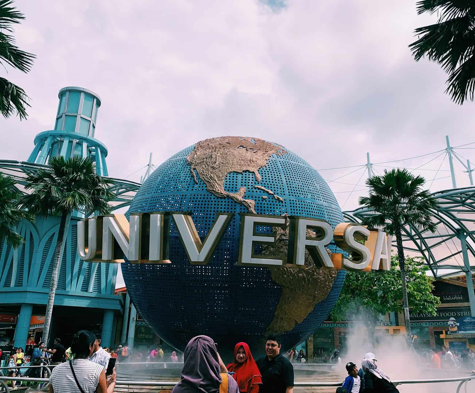 Large globe with Universal written across it out front of Universal Studios Singapore