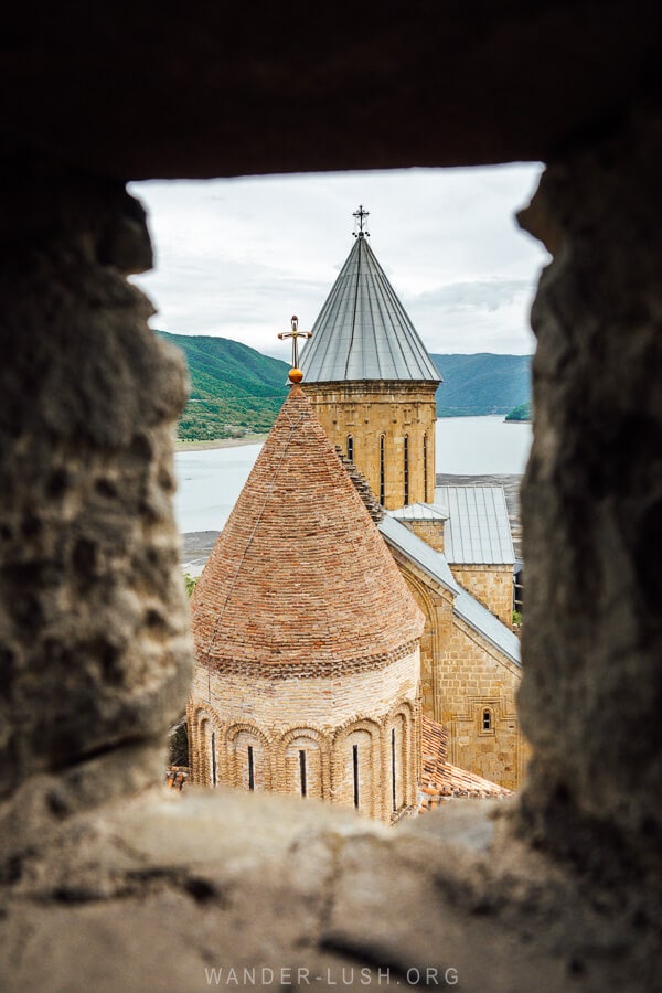 View of church towers and Zhinvali Reservoir from the top of the tower at Ananuri Fortress.