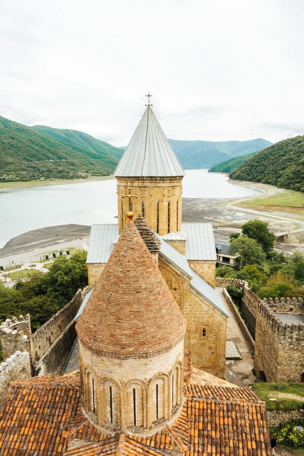 View of church towers and Zhinvali Reservoir from the top of the tower at Ananuri Fortress.