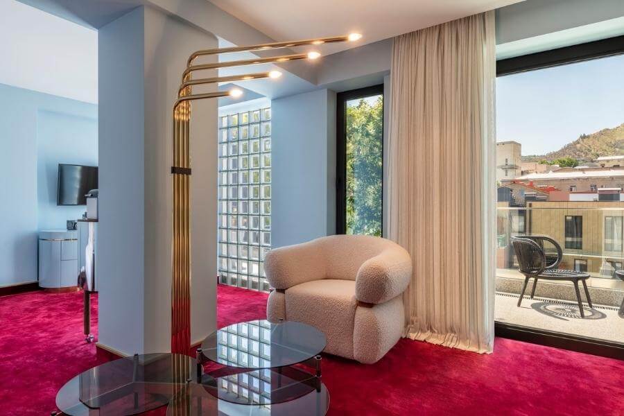 A new hotel in Tbilisi with pink carpet and art deco lights.