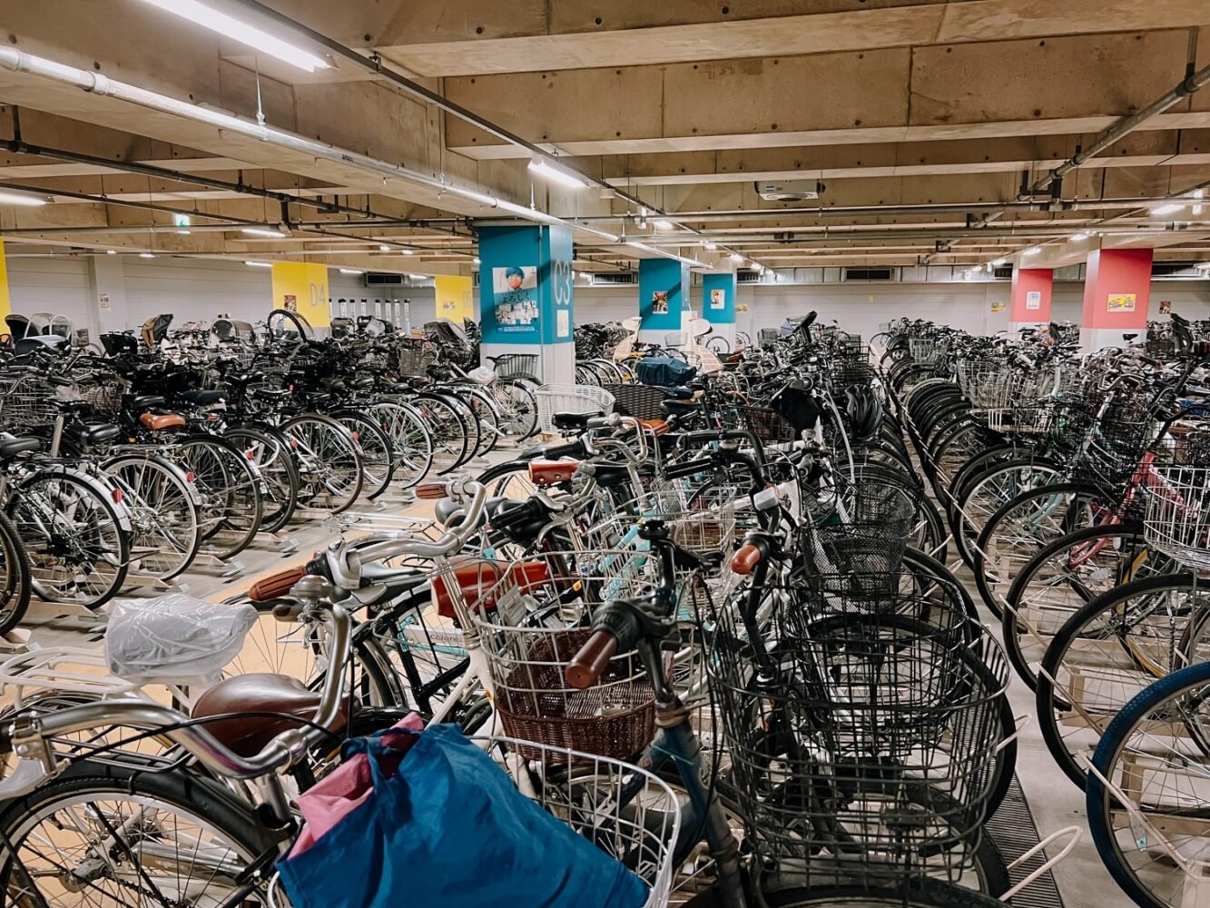 Hundreds of parked bikes in an underground bicycle parking lot in Tokyo, Japan.