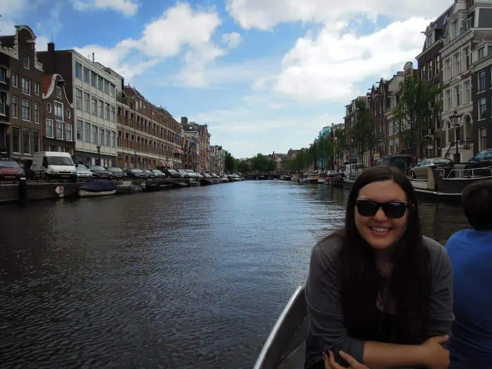 travelling alone for the first time, solo travel, boat trip on the canals of Amsterdam