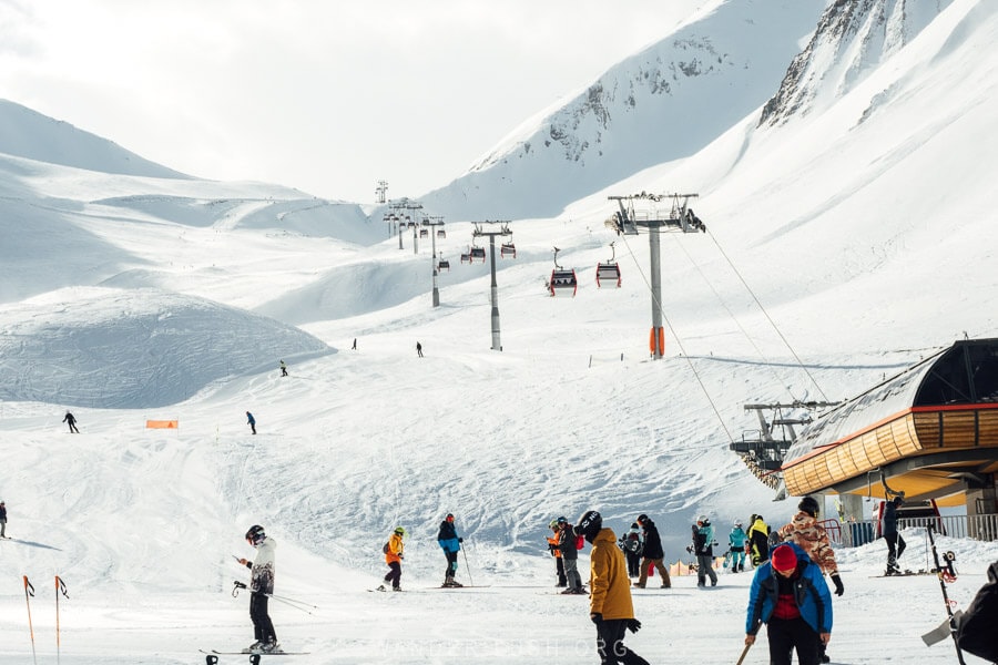 Skiers and snowboarders on the slopes in Gudauri, Georgia.