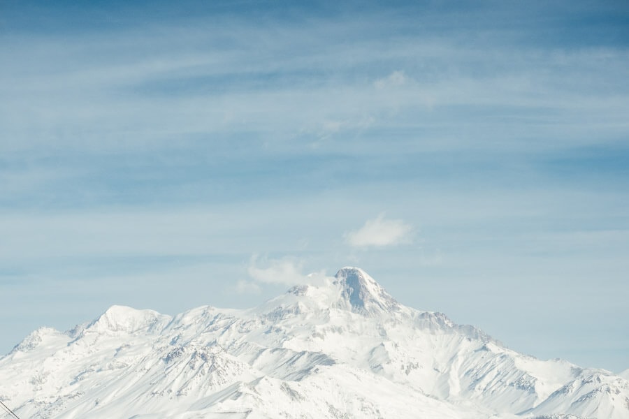 A view of Mount Kazbek against a blue sky in Gudauri, Georgia.