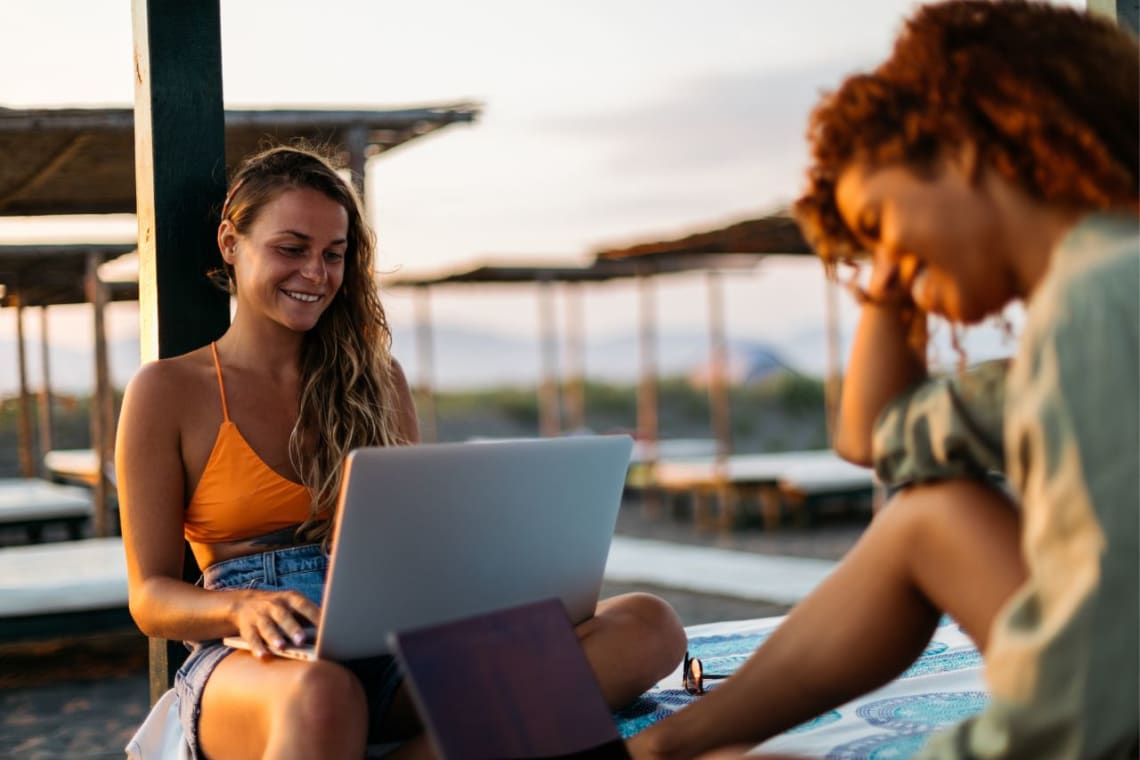 Digital nomad working with her laptop outdoors