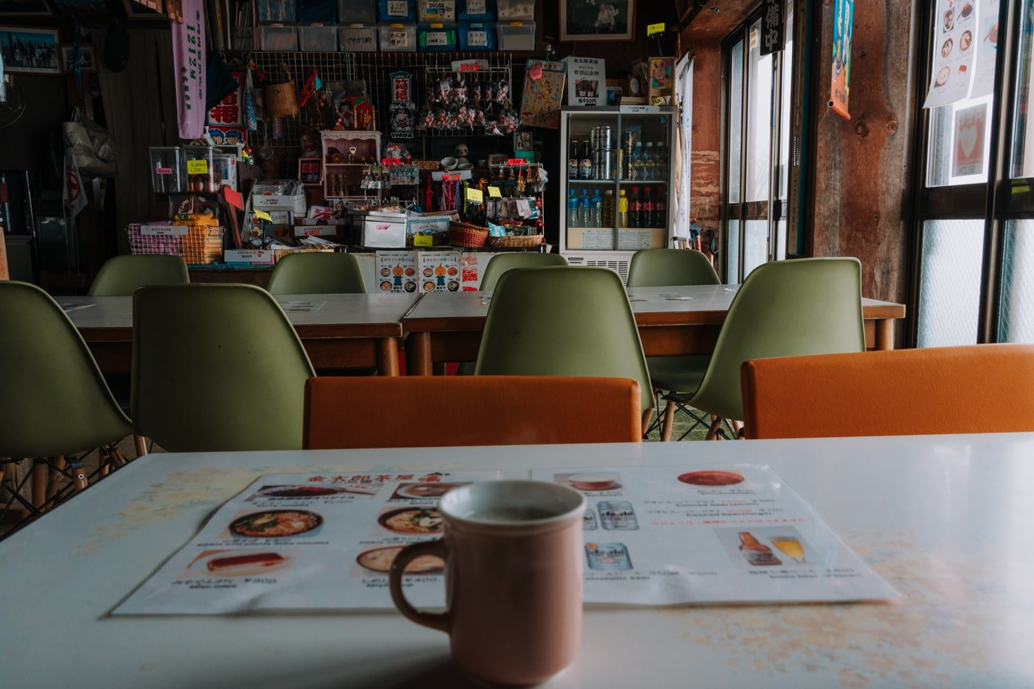 A cup of hot Japanese amesake on table inside the summit teahouse on Mount Kintoki.