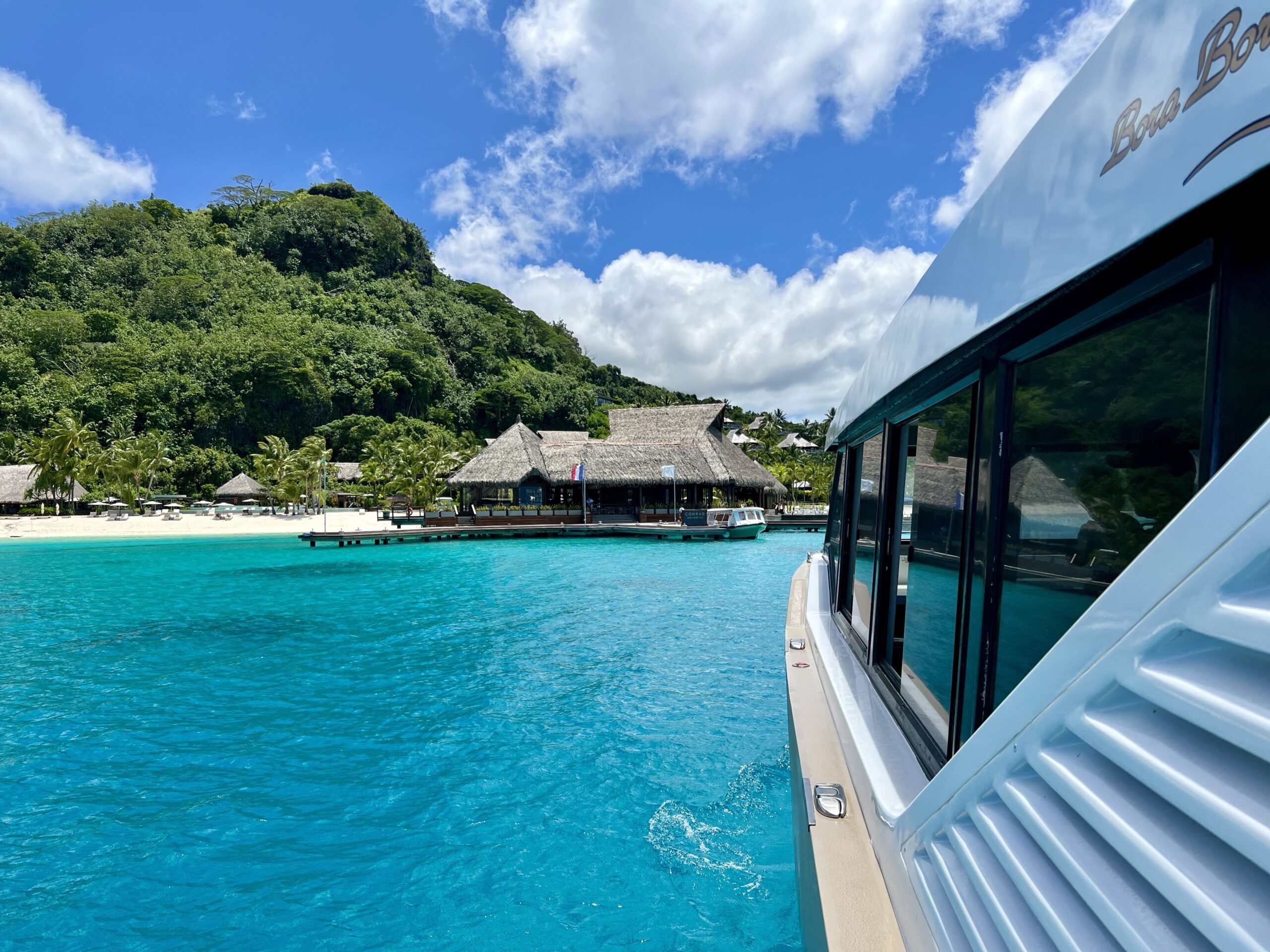 conrad bora bora nui boat pulling into dock