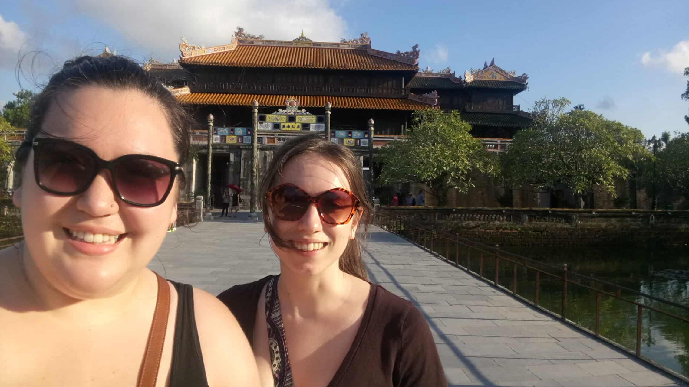 Riana and Emilie taking a selfie in front of the Hue Historic Citadel, Imperial City during one day in Hue Vietnam