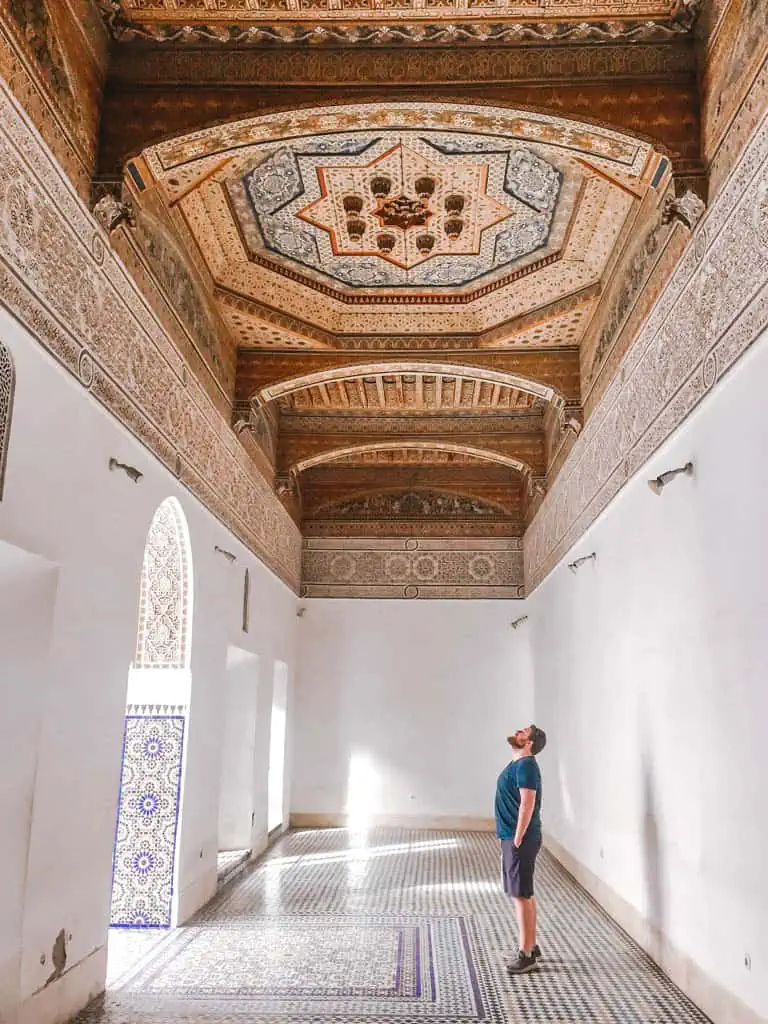 Colin staring up at an ornate ceiling at Bahia Palace in Marrakech Morocco