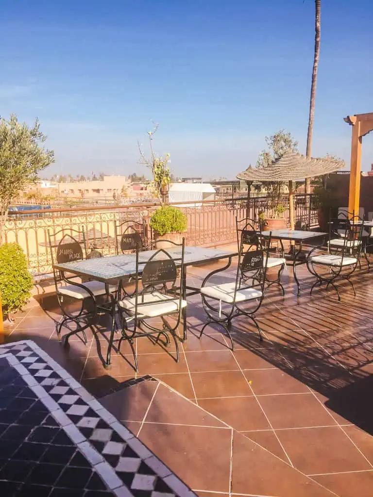 Rooftop with tables and chairs at Riad Marraplace in Marrakech Morocco 