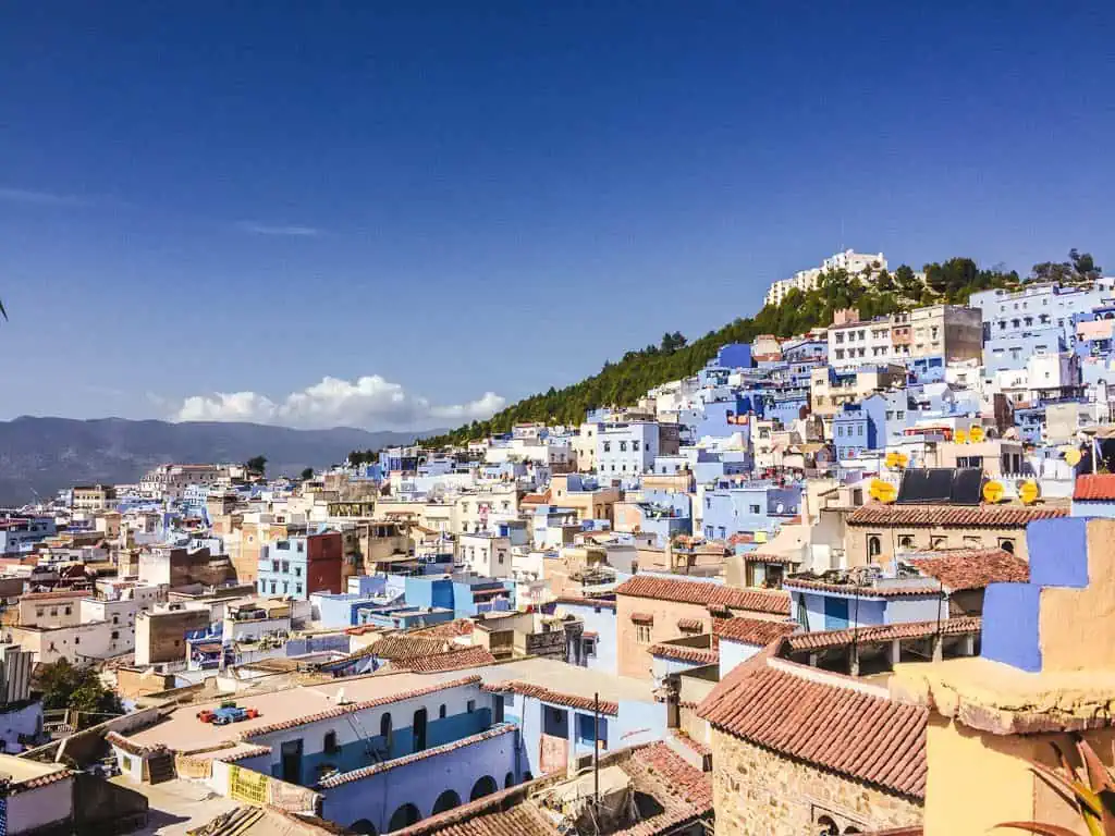 View of Chefchaouen from Aladdin Cafe looking at the white and blue houses on the mountainside