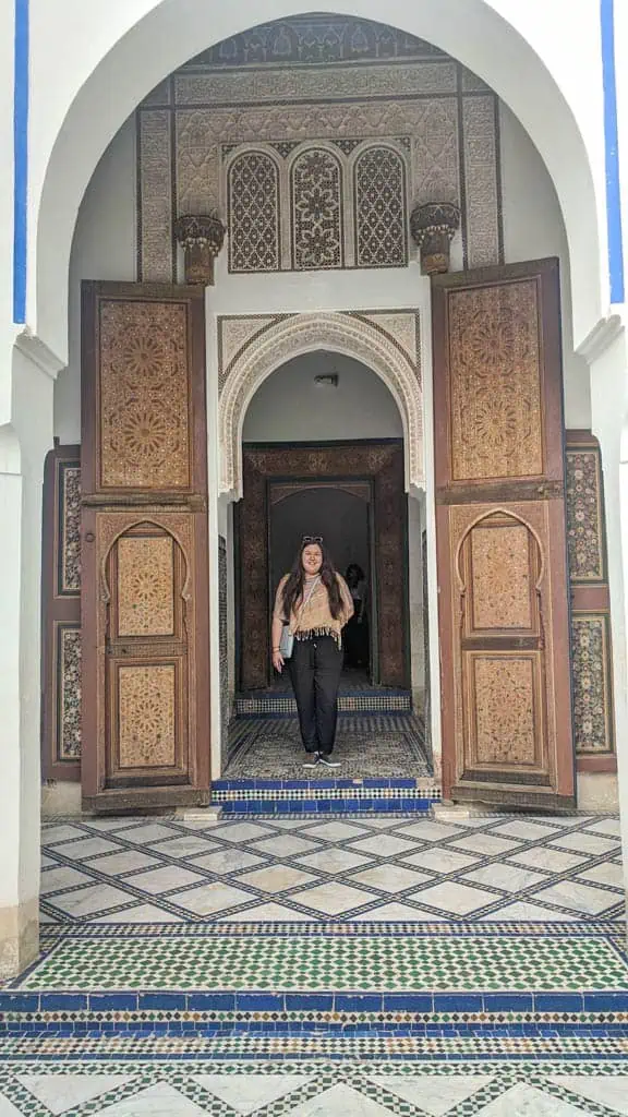 Riana standing in a doorway at the Bahia Palace in Marrakech Morocco 