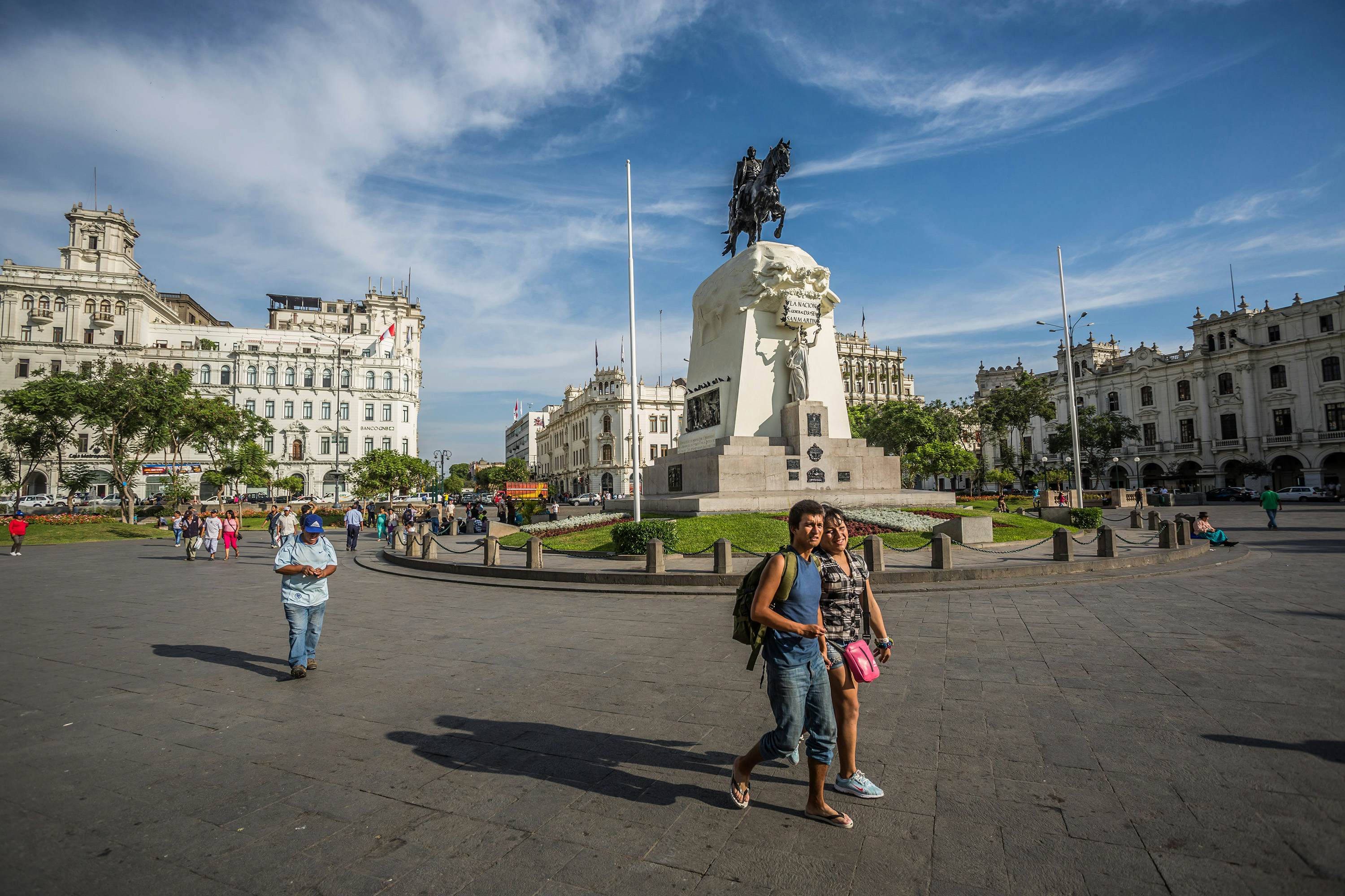 Pedestrians walk in the San Martin park in Lima, Peru