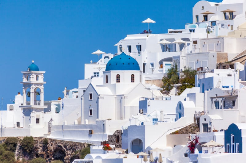 Whitewashed buildings and blue domes in Imerovigli, Santorini