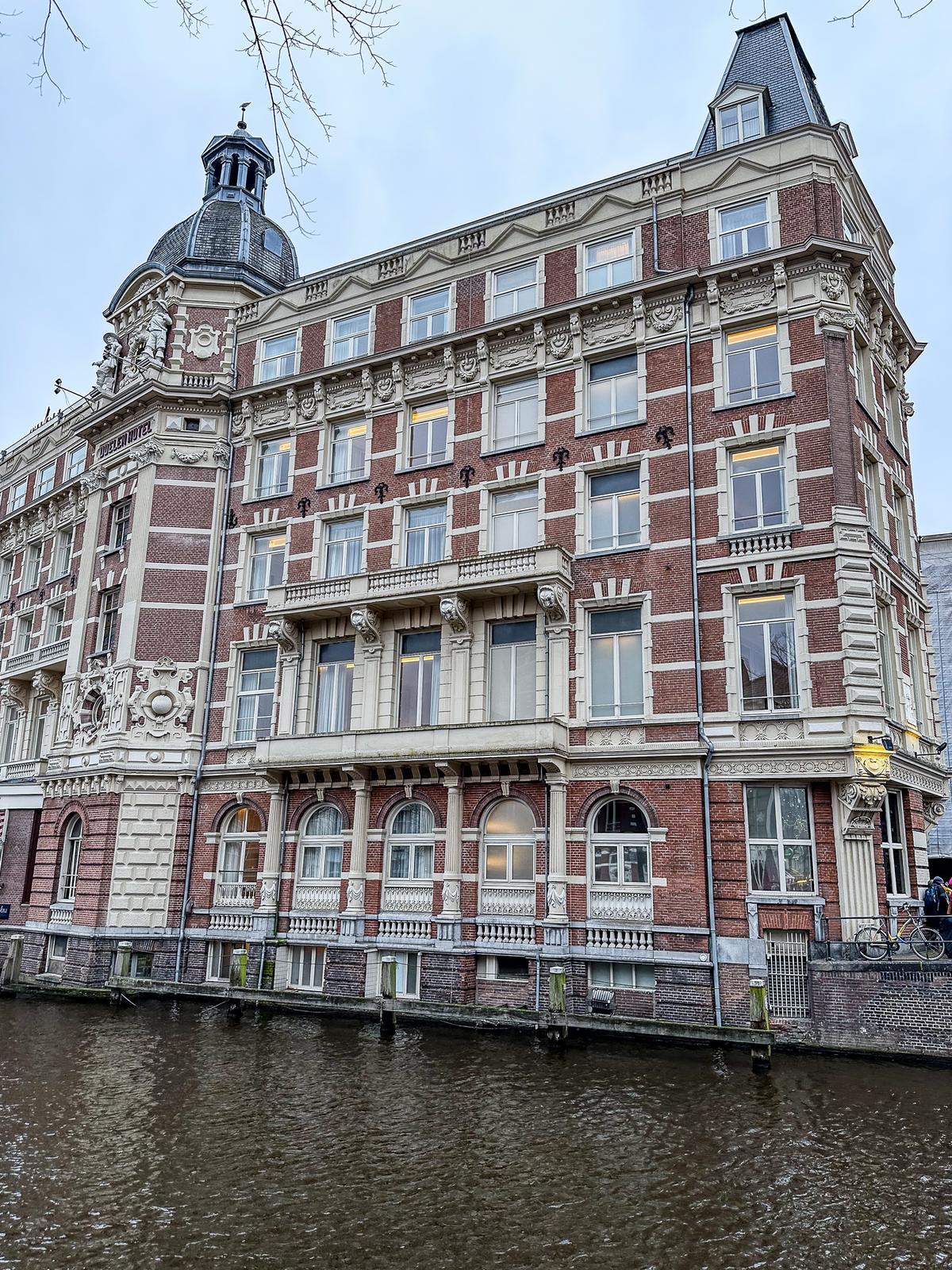 Tivoli Doelen Amsterdam Hotel facade with Renaissance architecture on canal