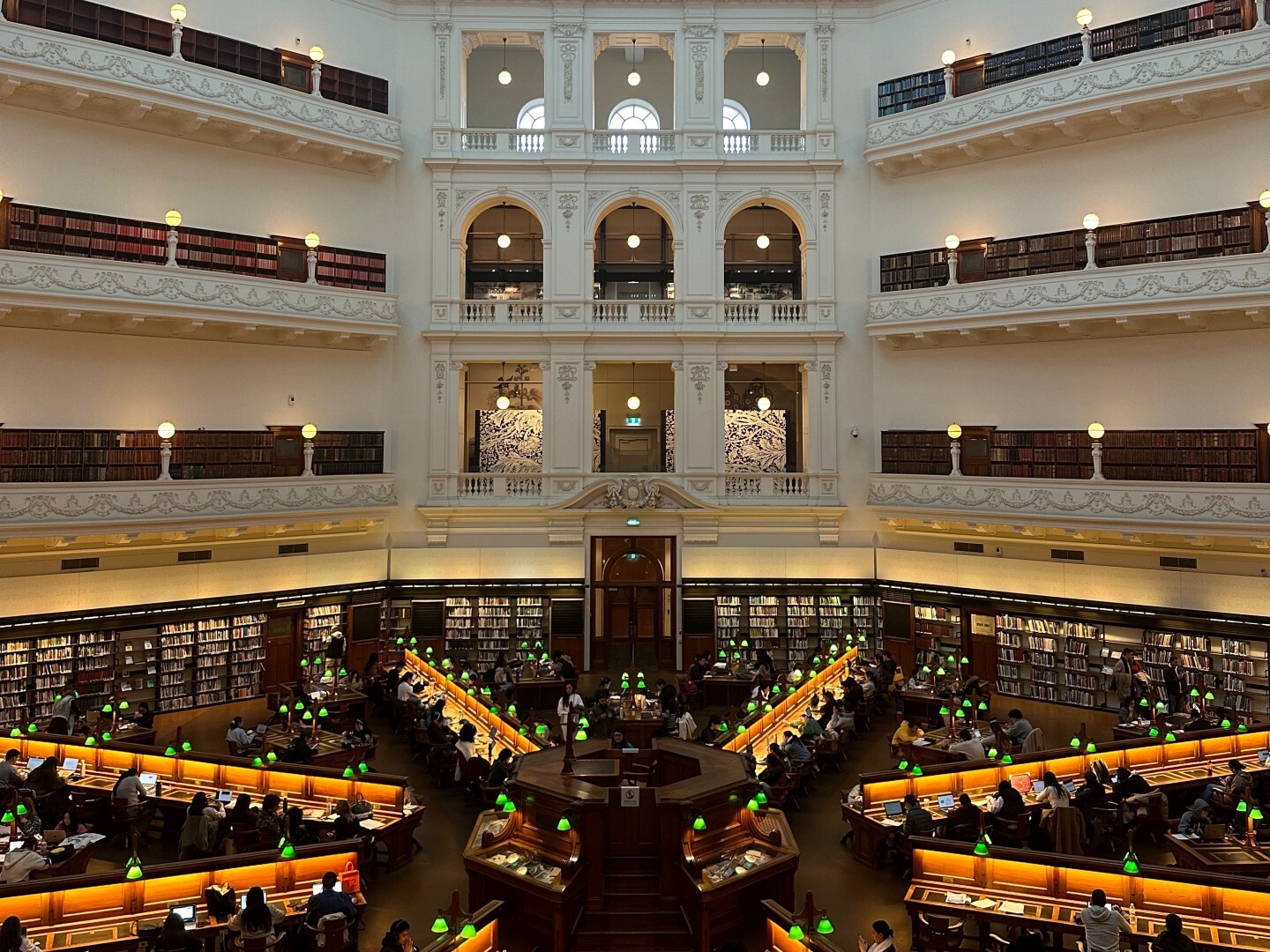 High view of rows of desks in spoke formation at Melbourne's State Library Victoria 