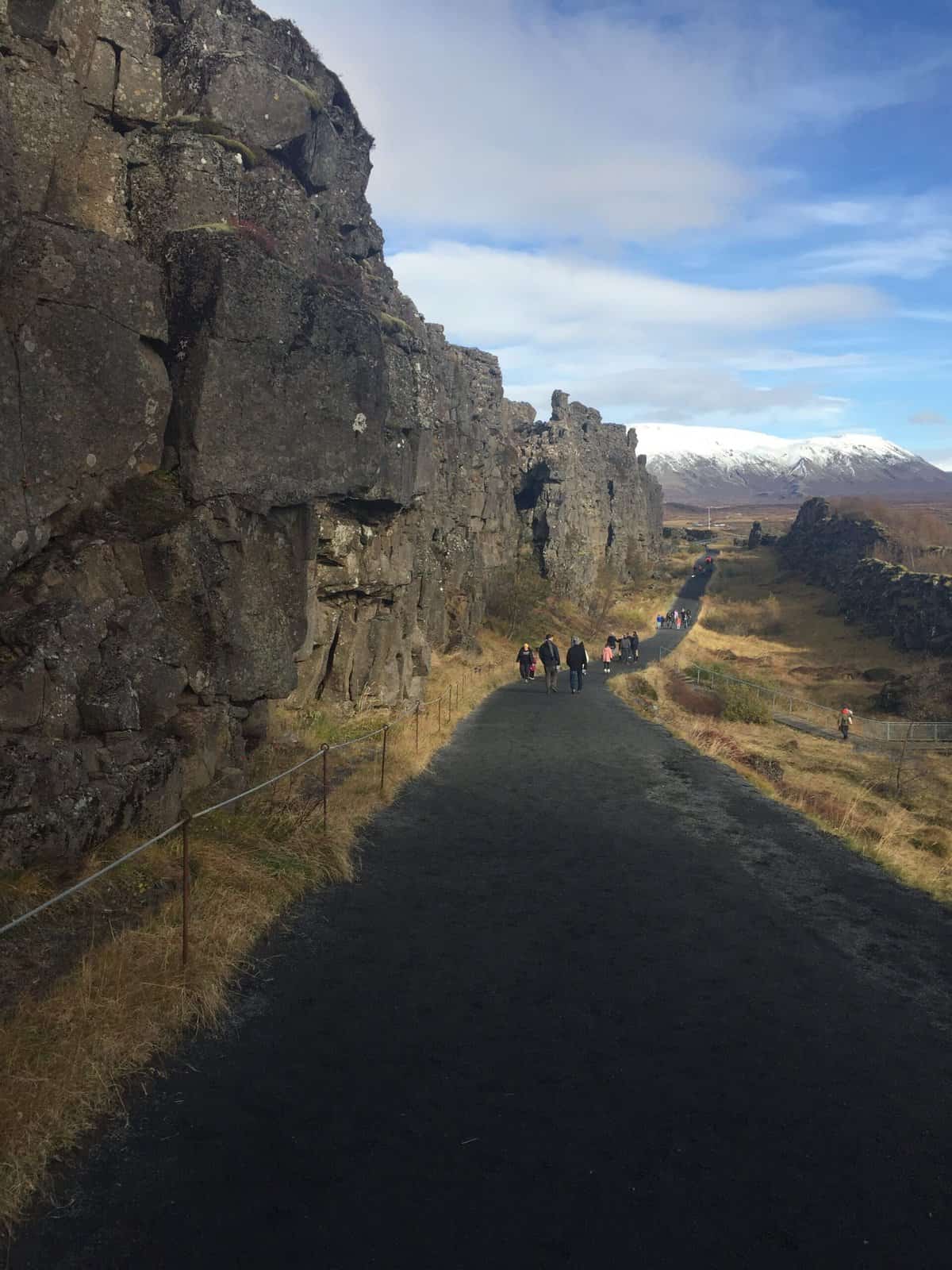 Walking down the path to the Almannagjá gorge in Thingvellir National Park, Iceland