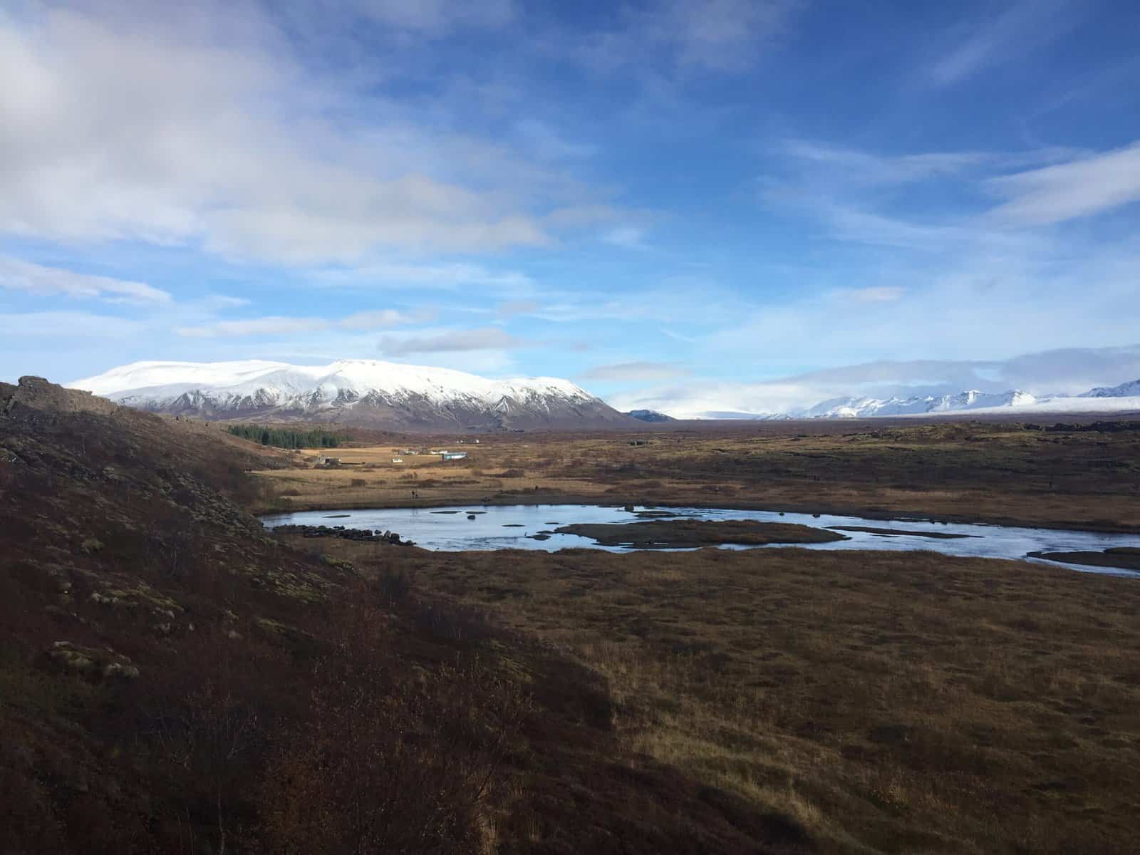 View of snowcapped mountains and vast grasslands from Thingvellir National Park, Golden Circle, Iceland