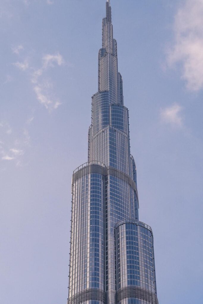 Majestic Burj Khalifa against blue sky, symbolizing Dubai's architectural innovation.