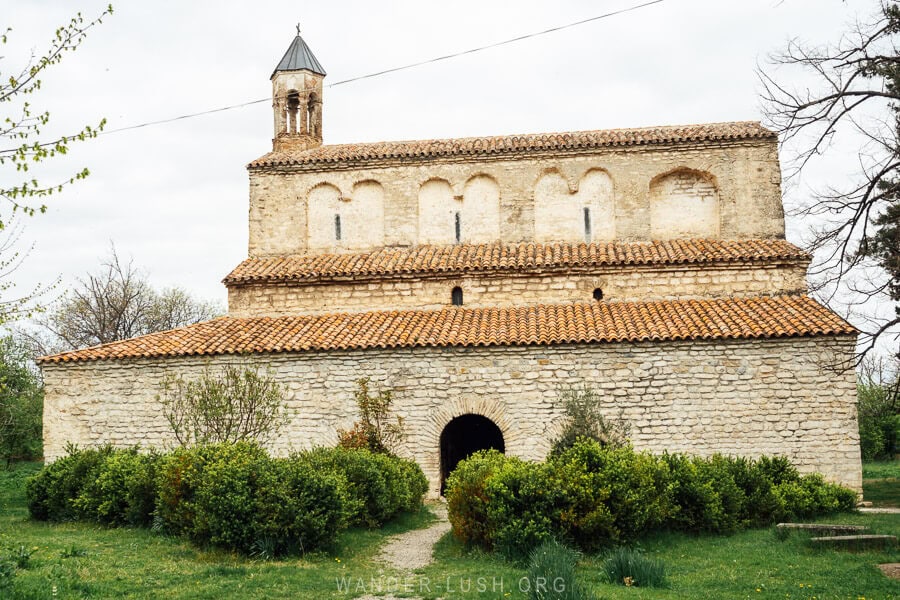 Gvtismshoblis Midzinebis Tadzari, a large church with a belltower and long cloister in the village of Vazisubani in Georgia.