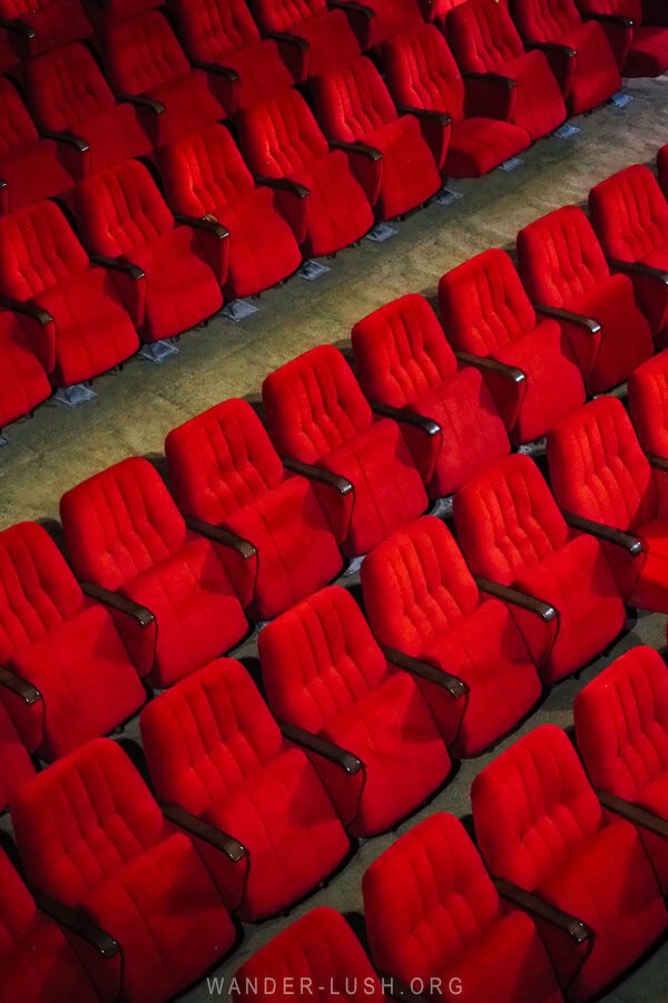 Rows of red velvet seats in the theatre at Vazisubani Palace of Culture.