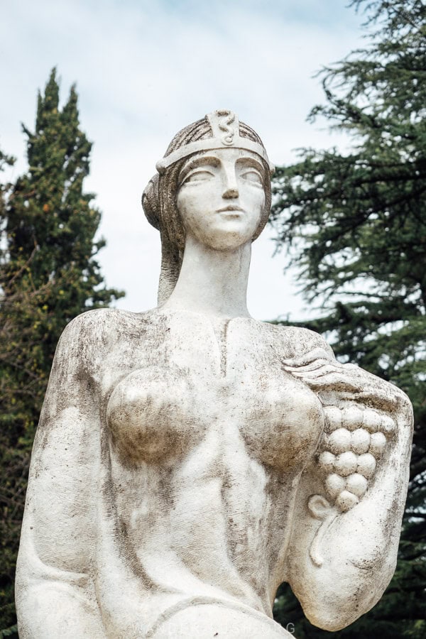 A Soviet-style sculpture of a woman clutching a bunch of grapes at the entrance to the Akhtala resort and park in Gurjaani.