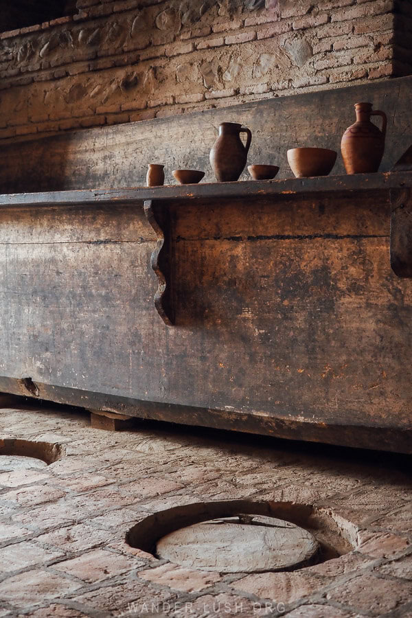 An old cellar with clay vessels and qvevri.