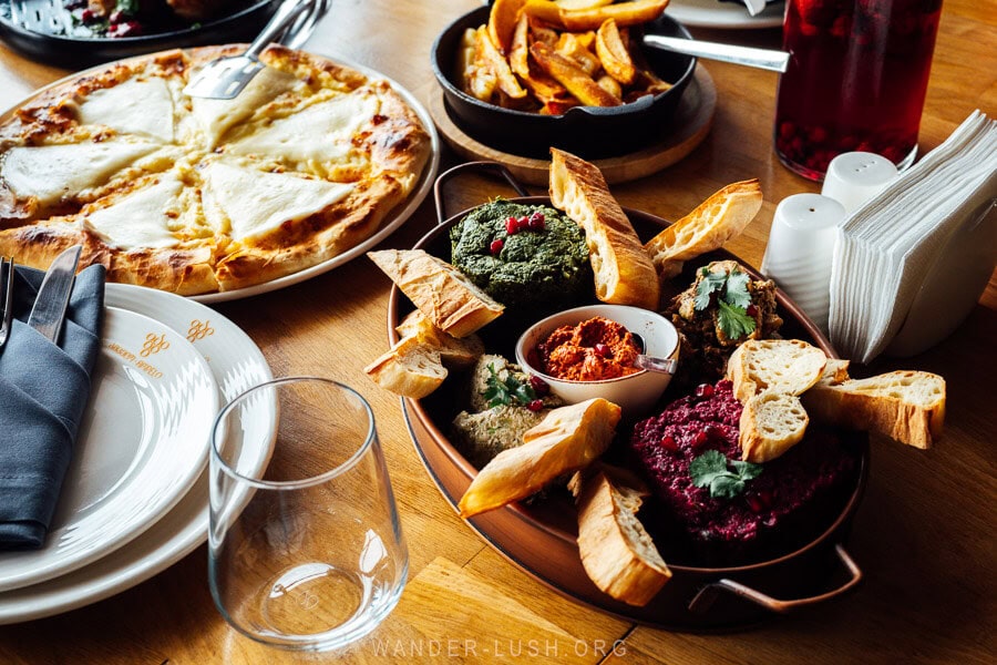 A table spread with Georgian food at Ampelo restaurant in Gurjaani.