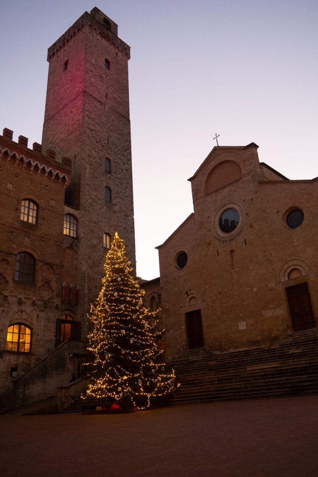 Christmas tree lighting at dusk in San Gimignano, Italy