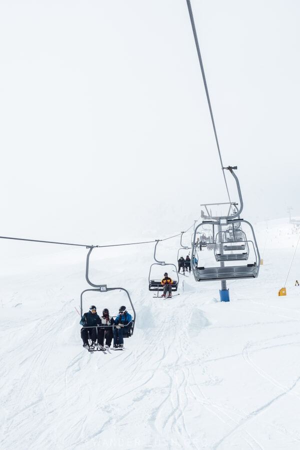 Passengers ride an open ski chairlift in Gudauri.