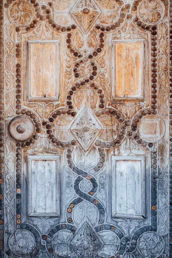 A carved wooden door at the Sioni Basilica church in Geogia.