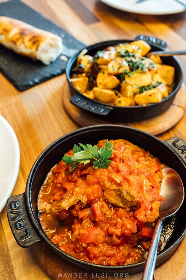 Georgian cuisine served in cast iron dishes at a restaurant in Gudauri.