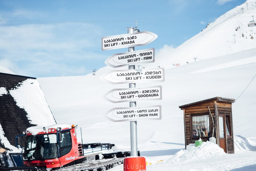 A signpost points the way to the different chair lifts at Gudauri.