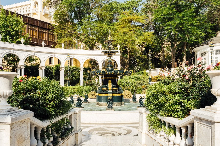 A fountain surrounded by flowering gardens inside the Philharmonia Garden in Baku, Azerbaijan.