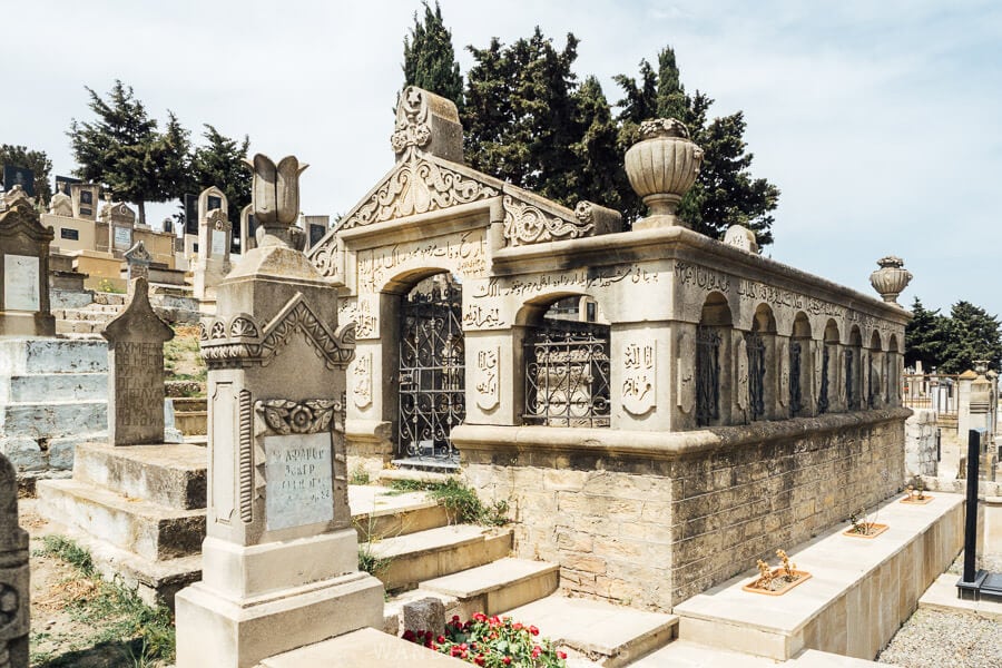 Gravestones and a beautiful mausoleum at the historic cemetery in Balakhani, Azerbaijan.