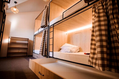 Modern dorms in a popular hostel in Gudauri ski resort.
