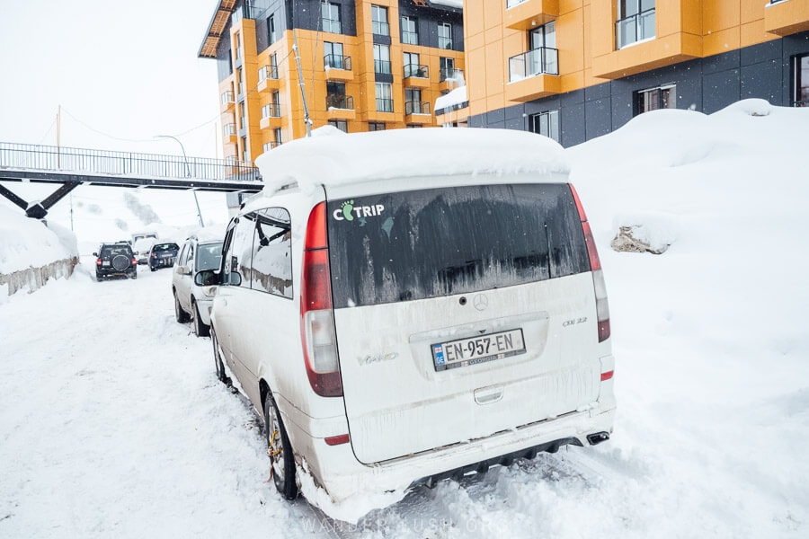 A white van parked in the snow in Gudauri, Georgia.