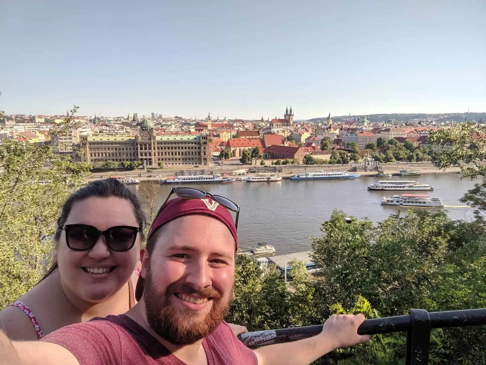 Selfie of Colin and Riana in front of a viewpoint of Prague and the river from Letna Park