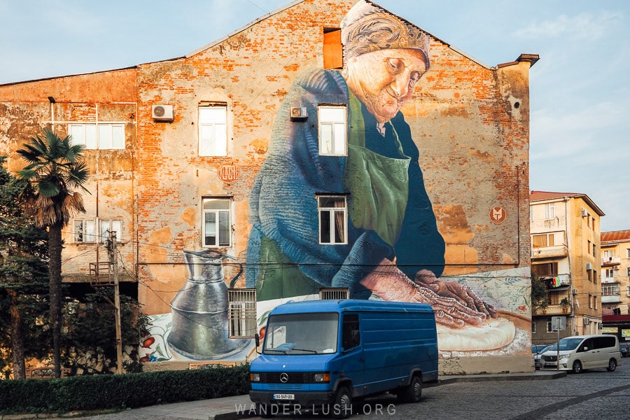 With Love by Sasha Korban, the most famous street art mural in Kutaisi depicting a woman baking khachapuri.