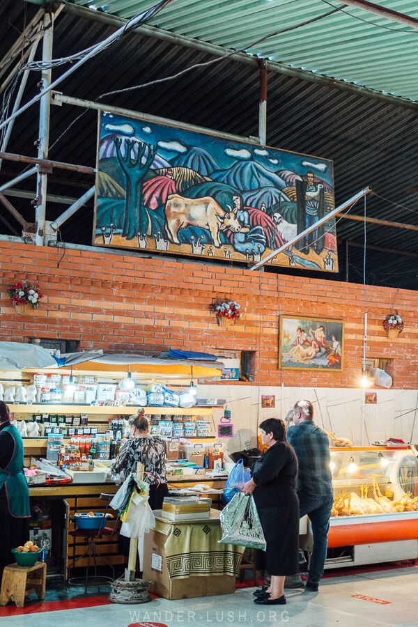 People shop at a local market in Kutaisi Georgia.