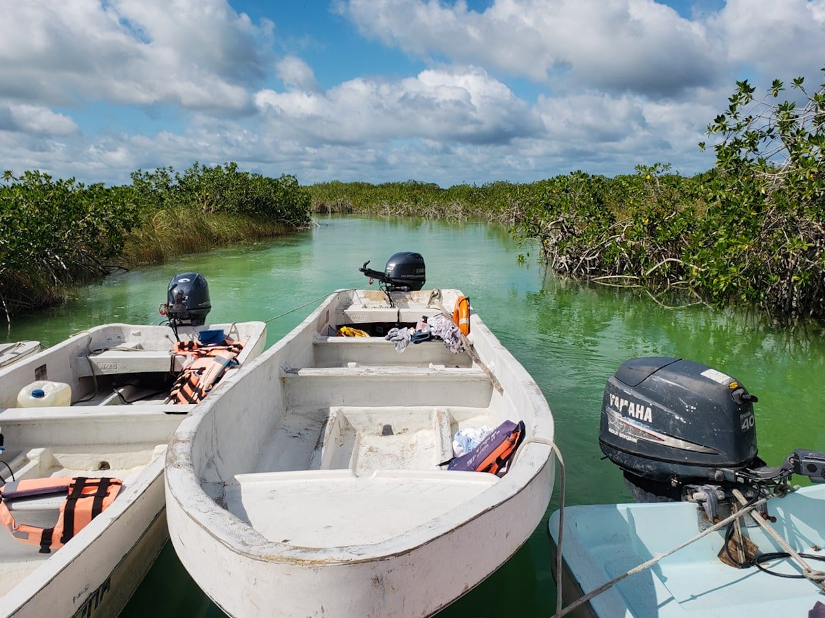 Boats at dock in Sian Ka'an Biosphere Reserve for the Muyil lazy river float.