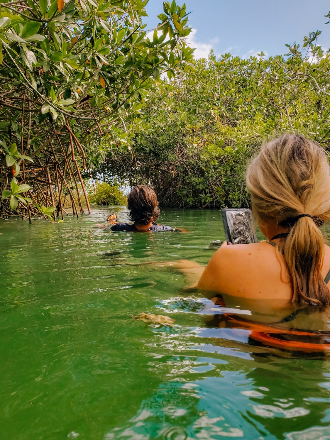 Travelers floating down a Mayan trading route in the Sian Ka'an Biosphere Reserve, near Tulum Mexico.