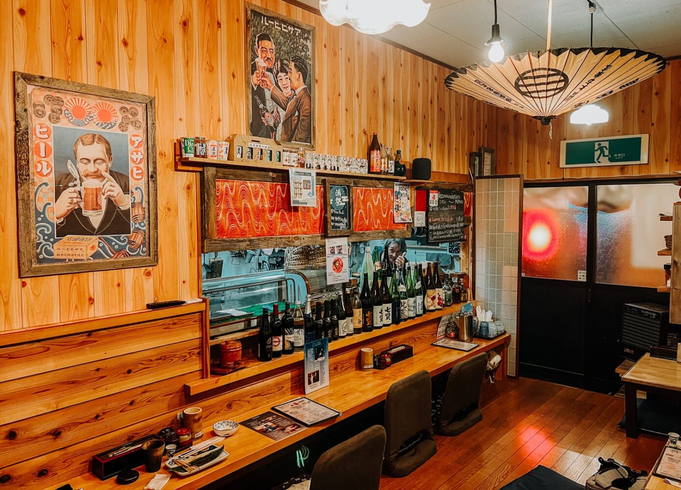 Inside a cozy, retro izakaya bar in Fujikawaguchiko, Japan.